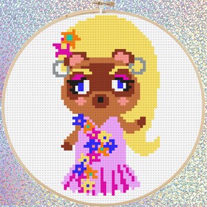 May include: Cross stitch pattern of a cartoon raccoon wearing a pink dress with floral accents and blonde hair. The raccoon has blue eyes and pink blush.