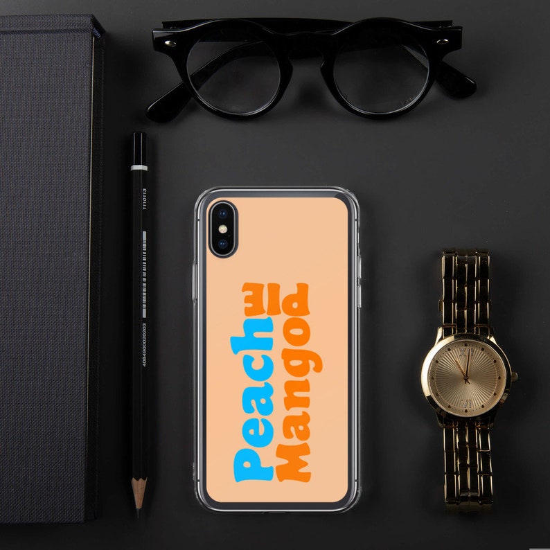 May include: A clear phone case with a peach background and the text "Peachy Mango" in blue and orange letters.