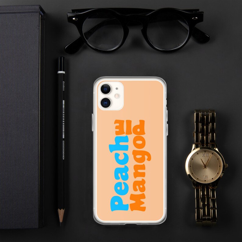 May include: A clear phone case with a peach background and the text "Peachy Mango" in blue and orange letters.