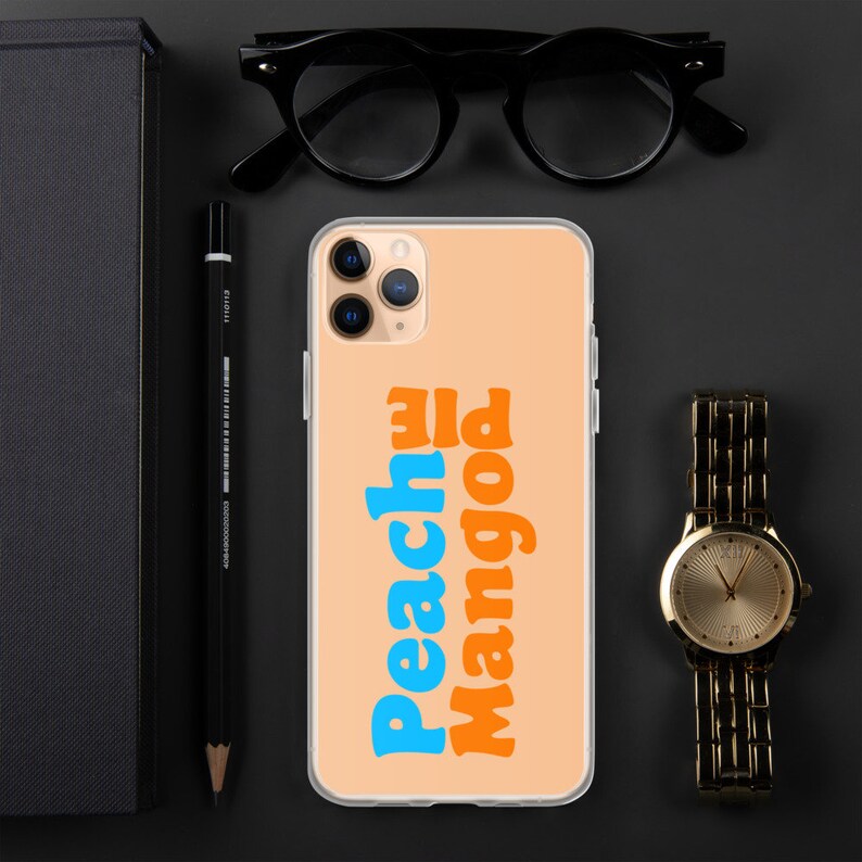 May include: A clear phone case with a peach background and the words "Peach Pie Mango" in blue and orange text.