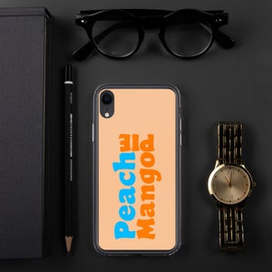 May include: A clear phone case with a peach background and the text "Peach Mango" in blue and orange letters.
