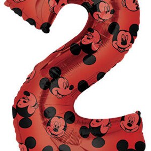 May include: Red Mickey Mouse balloon shaped like the number 2. The balloon is covered in Mickey Mouse faces.