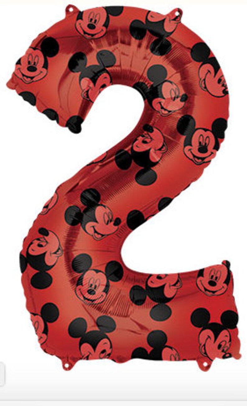 May include: Red Mickey Mouse balloon shaped like the number 2. The balloon is covered in Mickey Mouse faces.