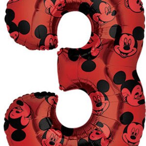 May include: Red foil balloon shaped like the number 3 with a Mickey Mouse pattern. The balloon is decorated with black Mickey Mouse heads.