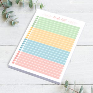 To Do List Notepad.  5.5x8.5, 50 sheets per pad.  Bubbles to check off items as finished.  Bright Earthy Colors