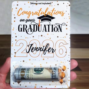 May include: A set of three ceramic mugs with a speckled, matte finish. The mugs are in shades of cream, light brown, and dark brown. Each mug has a simple, minimalist design, perfect for coffee or tea.