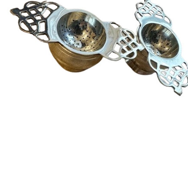 Pair of Victorian silver plated tea strainers (double handle)