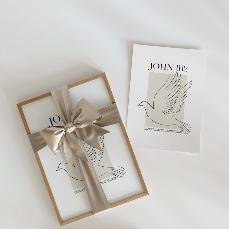 May include: A framed print with a dove illustration and the text "JOHN 8:12"  "I am the light of the world, whoever follows me will never walk in darkness, but will have the light of life."