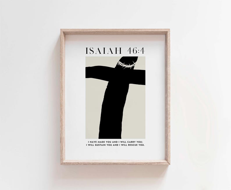 May include: A framed print with a black and white illustration of a cross with a crown of thorns. The text "ISALAH 46:4" is at the top of the print. The text "I HAVE MADE YOU AND I WILL CARRY YOU I WILL SUSTAIN YOU AND I WILL RESCUE YOU." is at the bottom of the print.