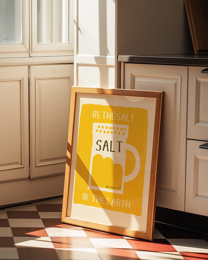 May include: A framed print with a yellow background and a white salt shaker illustration. The text reads "Be the salt, Salt, Matthew 5:13, Of the Earth."