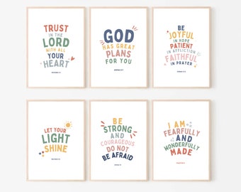 May include: Six printable wall art prints with inspirational quotes and bible verses in colorful, handwritten fonts. The quotes include "Trust in the Lord with all your heart", "God has great plans for you", "Be joyful in hope, patient in affliction, faithful in prayer", "Let your light shine", "Be strong and courageous, do not be afraid", and "I am fearfully and wonderfully made".