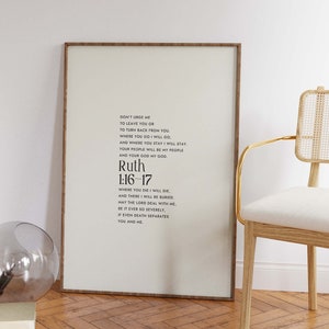 May include: A framed print with a white background and black text. The text is a quote from the Bible, Ruth 1:16-17, which reads: "Don't urge me to leave you or to turn back from you. Where you go I will go, and where you stay I will stay. Your people will be my people and your God my God. Where you die I will die, and there I will be buried. May the Lord deal with me, be it ever so severely, if even death separates you and me."
