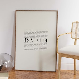 May include: A framed print with a white background and black text. The text is a bible verse from Psalm 121. The verse reads, "I lift up my eyes to the mountains - where does my help come from? My help comes from the Lord, the maker of heaven and earth. He will not let your foot slip - he who watches over you will not slumber: indeed, he who watches over Israel will neither slumber nor sleep. Psalm 121. The Lord watches over you - the Lord is your shade at your right hand, the sun will not harm you by day, nor the moon by night. The Lord will keep you from all harm - he will watch over your life: the Lord will watch over your coming and going both now and forevermore."