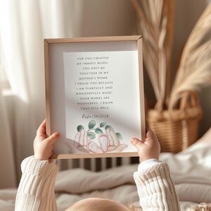 May include: A framed print with a watercolor illustration of hands holding tiny feet. The print features the text "FOR YOU CREATED MY INMOST BEING: YOU KNIT ME TOGETHER IN MY MOTHER'S WOMB I PRAISE YOU BECAUSE I AM FEARFULLY AND WONDERFULLY MADE: YOUR WORKS ARE WONDERFUL, I KNOW THAT FULL WELL. Psalm 139:13-14"