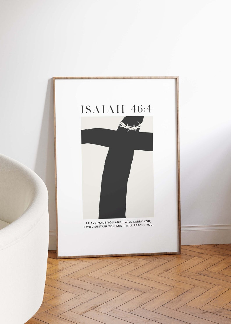 May include: A framed print with a black and white illustration of a cross with a crown of thorns. The text "ISAIAH 46:4" is at the top of the print. The text below the illustration reads "I HAVE MADE YOU AND I WILL CARRY YOU; I WILL SUSTAIN YOU AND I WILL RESCUE YOU."