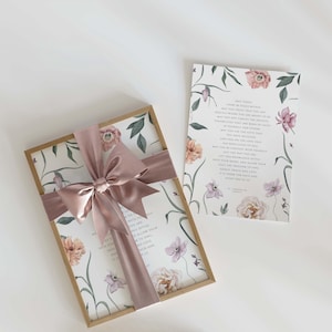 May include: A gift box with a floral design and a pink satin ribbon. The box is tied with a bow and contains a card with a floral design and a message about peace within. The card reads "May today there be peace within. May you trust your heart to be exactly where you are right now. May you not forget the infinite possibilities that are always within you. May you and those that you love find the love that has been given to you. May you find the love you have received. And find the love that you may pass on to others. May you be content with yourself and your way. May you settle into the stillness and allow your soul, your mind, and your heart to count the blessings. May it there be peace and love, grace, praise and time. It is there for each of us. Every one of us."