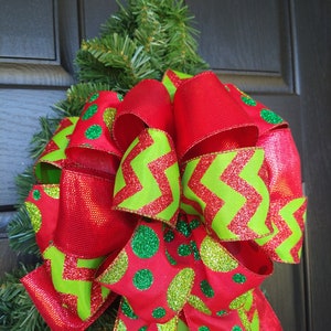 Whimsical Red and Green Christmas Colors on Wired Ribbon Tied Into A Wreath Bow