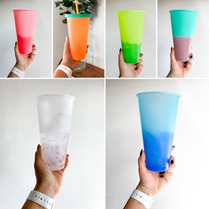 May include: A set of six ombre plastic cups with different color combinations. The cups are all the same size and shape, and they are all made of clear plastic. The cups are perfect for serving drinks at parties or events.