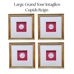 May include: Four framed intaglios with gold frames, white mounts, and red backgrounds. Each frame contains a white relief image. The text at the top reads "Large Grand Tour Intaglios Cupids Reign."