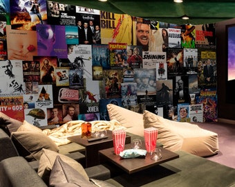 May include: A home theater room with a large screen displaying the 20th Century Fox logo. The room is decorated with movie posters and has comfortable seating.