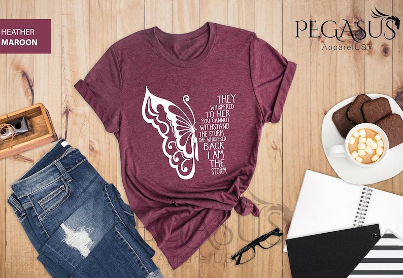 a women's t - shirt with a butterfly on it