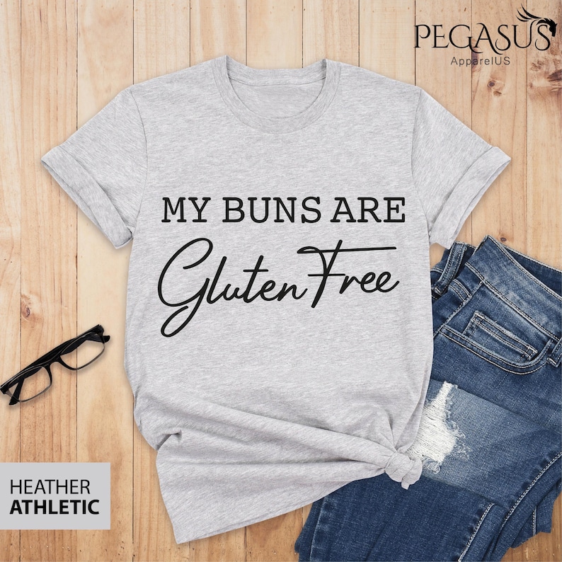 May include: Gray heather athletic t-shirt with the text "My Buns Are Gluten Free" in black.