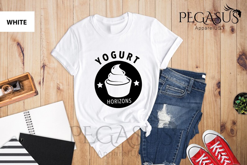 May include: White t-shirt with a black circle graphic that says "Yogurt Horizons" and features a stylized image of a yogurt container with a swirl of yogurt on top.