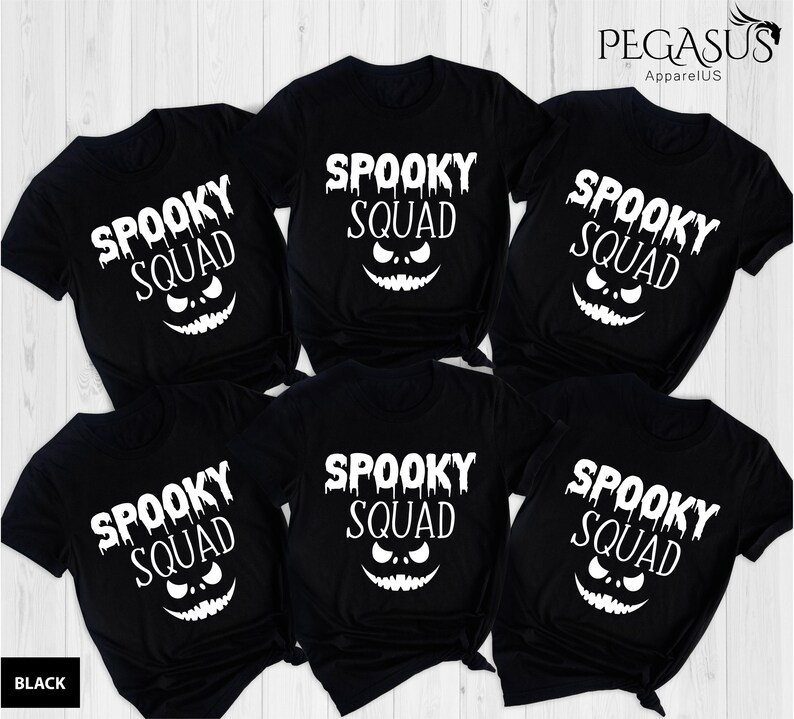 May include: Black t-shirts with the text "SPOOKY SQUAD" in white, featuring a jack-o'-lantern face. The shirts are short-sleeved and suitable for Halloween. The brand name "PEGASUS ApparelUS" is visible in the top right corner.