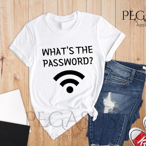 May include: White t-shirt with the text "What's the password?" and a wifi symbol printed on it.