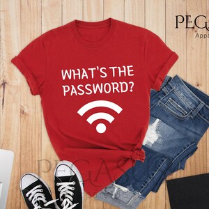 May include: Red t-shirt with white text that says "What's the password?" and a white wifi symbol.