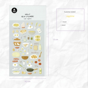 Könnte beinhalten: Ein Bogen "Daily Deco Stickers" zum Thema "eggtime". Die Aufkleber zeigen Illustrationen verschiedener Eierspeisen, Kochutensilien und Zutaten. Der Bogen ist 9,2 cm breit und 15 cm hoch.