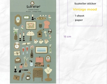 May include: A sheet of vintage-style stickers featuring illustrations of home decor, furniture, and other objects. The stickers are on a light blue background and measure 9.2 inches by 15 inches. The text on the sticker sheet reads "Suatelier stickers no.1121: vintage mood".