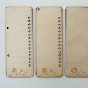 May include: Three wooden loom boards with rows of holes for weaving. Each board has a yarn ball and heart graphic with the text "@Laurettecraftsuk".