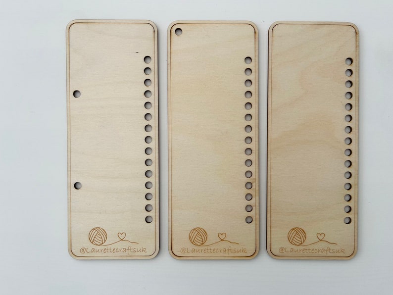 May include: Three wooden loom boards with rows of holes for weaving. Each board has a yarn ball and heart graphic with the text "@Laurettecraftsuk".