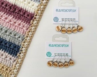 May include: Two sets of wooden stitch markers with metal loops. The first set has five markers labeled "WS" for "wrong side". The second set has five markers labeled "RS" for "right side".