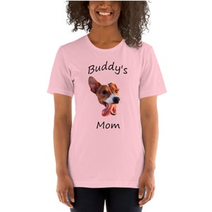 May include: Pink t-shirt with a graphic of a dog's head and the text "Buddy's Mom"