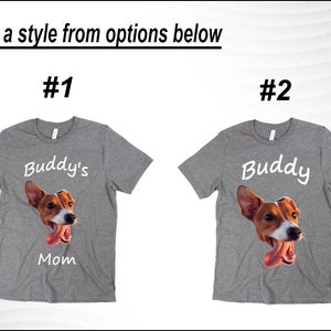 May include: Two gray t-shirts with a dog's face and the text "Buddy's Mom" on one shirt and "Buddy" on the other.