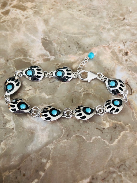 Paw in hand bracelet store