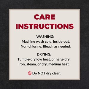 May include: A cream-colored card with care instructions in red text. The card reads "CARE INSTRUCTIONS" at the top, followed by washing and drying instructions. The card advises to machine wash cold, tumble dry low heat, and not to dry clean.
