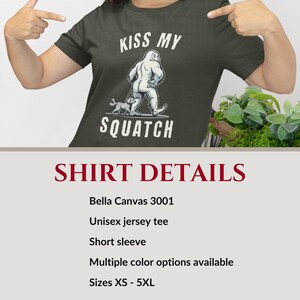 Funny “Kiss My Squatch” Bigfoot shirt featuring a sassy sasquatch walking a dog, available in multiple colors. Unisex Bella+Canvas 3001 short-sleeve, crewneck jersey-cotton tee for men and women, sizes XS-5XL, comfortable casual fit, perfect for dog owners, cryptid lovers, and fans of sarcastic humor.