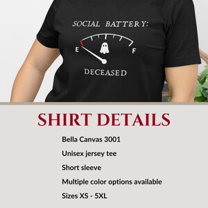 Alt text: Unisex Bella+Canvas 3001 jersey t-shirt in multiple colors and sizes XS–5XL featuring a playful spooky design that reads “social battery: deceased” with a ghost illustration and an empty fuel gauge, styled for introverts, paranormal fans, and ghost hunters who enjoy sarcastic Halloween humor and comfy graphic tees.