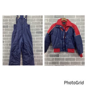 May include: A navy blue snow bib with adjustable shoulder straps and a front zipper closure, paired with a matching navy blue and red puffer jacket featuring a high collar, snap button front, and ribbed cuffs and hem.