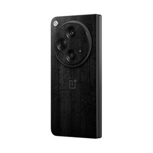 May include: A black smartphone with a textured wood-grain finish. The phone features a circular camera module with three lenses and a flash. The OnePlus logo is visible at the bottom. The phone is shown against a white background.