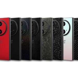 May include: A row of eight smartphones with different back designs. The phones are in various colors and patterns, including red, black, camouflage, and carbon fiber. Each phone has a large circular camera module.