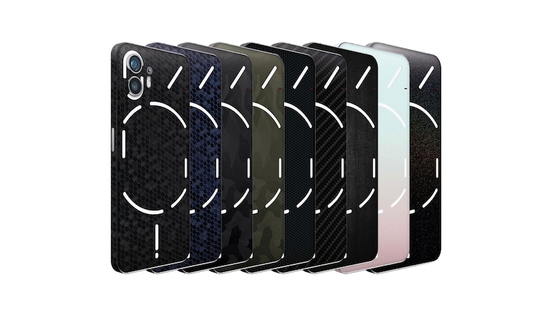 May include: A collection of phone cases in various designs, including black textured, navy blue, camouflage, and carbon fiber patterns. Each case features a white circular design with a line and a camera cutout.