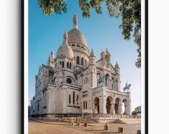 May include: A white stone building with a large dome and multiple smaller domes. The building has a symmetrical design with arches and columns. The building is surrounded by a paved area and trees.