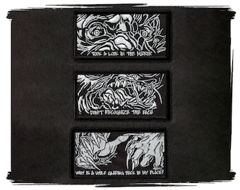 May include: Three black and white embroidered patches with a monster face and text. The top patch says "Took a look in the mirror". The middle patch says "Don't recognize the face". The bottom patch says "Why is a wolf glaring back in my place?"