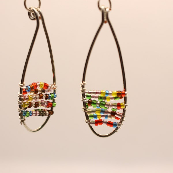 silver oval wire wrapped with multicolor seed beads strung throughout