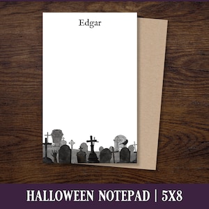May include: A black and white Halloween notepad with a graveyard scene and the name "Edgar" at the top. The notepad is 5 inches by 8 inches.