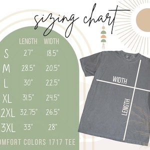 May include: A gray Comfort Colors 1717 tee shirt with a sizing chart. The chart lists shirt lengths and widths in inches for sizes S through 3XL. The shirt is laid flat, with lines indicating length and width.